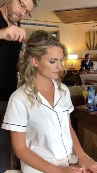 Alex Corbanezi finishing bridal hairstyle for Jaid wedding at dreams riviera cancun,mexico