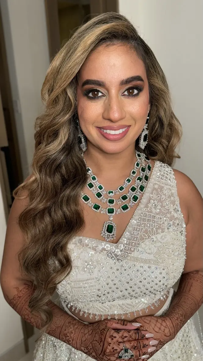 South Asian bride with Hollywood waves for reception night at hard rock los cabos
